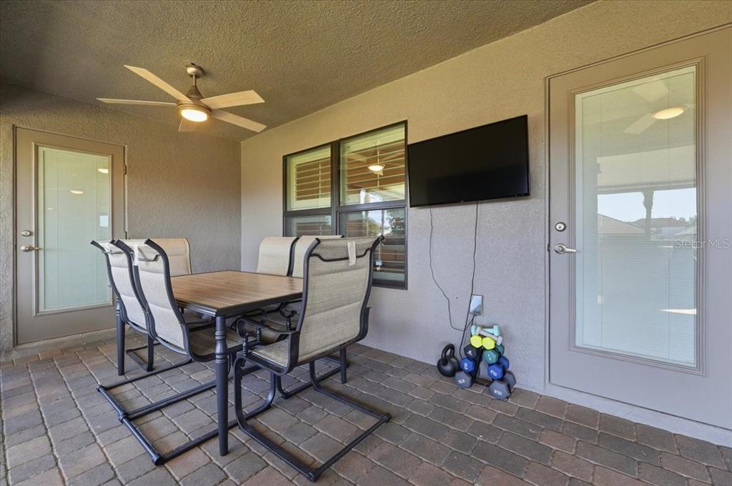 331 Cres Ridge Road Auburndale, FL 33823 - Photo 58 of 63 a view of a dining room with furniture and a flat screen tv