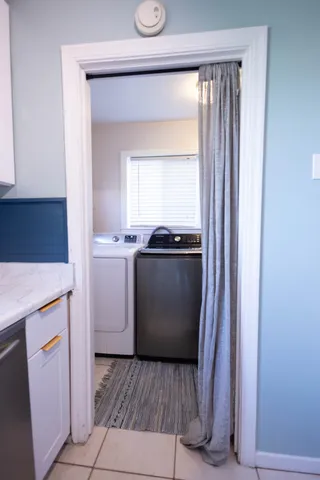 a utility room with washer and dryer