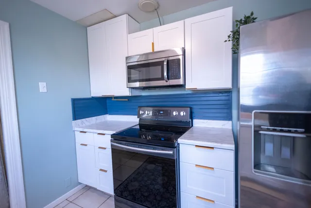 a kitchen with a stove and a microwave
