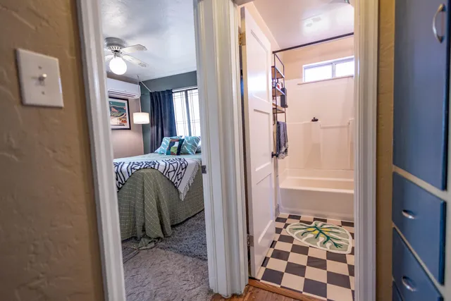 a bathroom with a glass shower door and a sink
