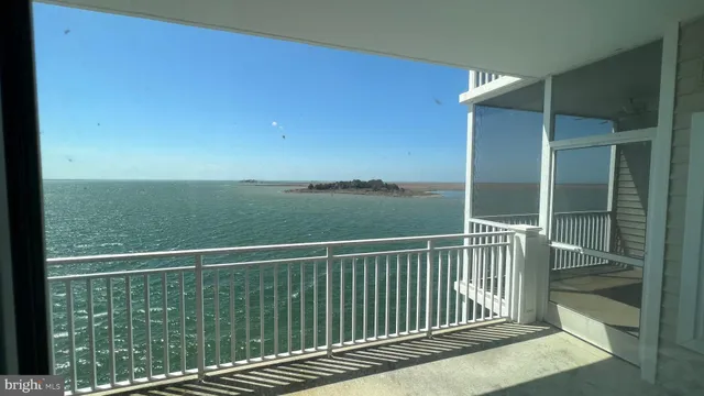 a view of balcony with floor to ceiling window and outdoor view
