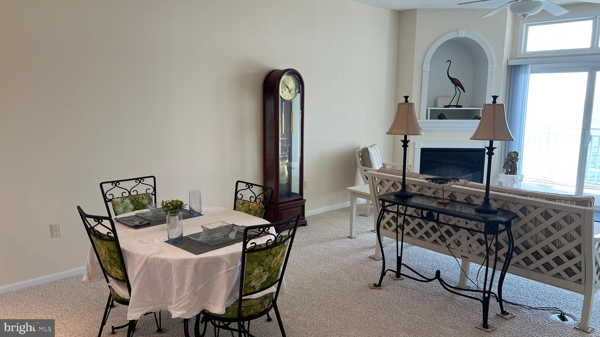 103 Williams Street, Unit 416 Crisfield, MD 21817 - Photo 12 of 38 a view of a dining room with furniture and chandelier