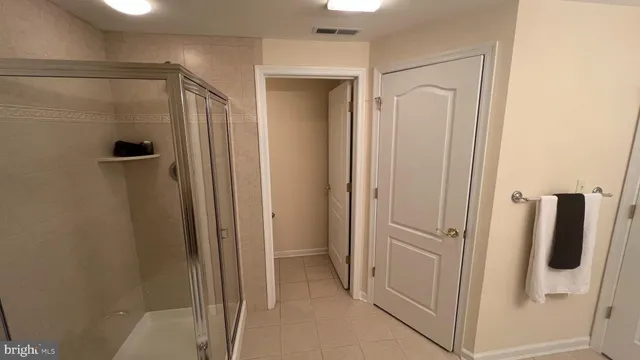 a white toilet sitting next to a white sink