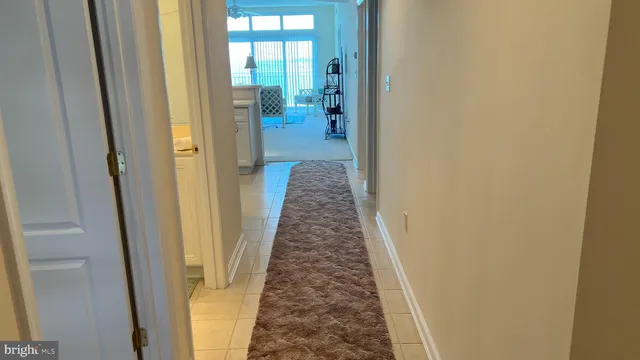 a view of room with stairs and wooden floor