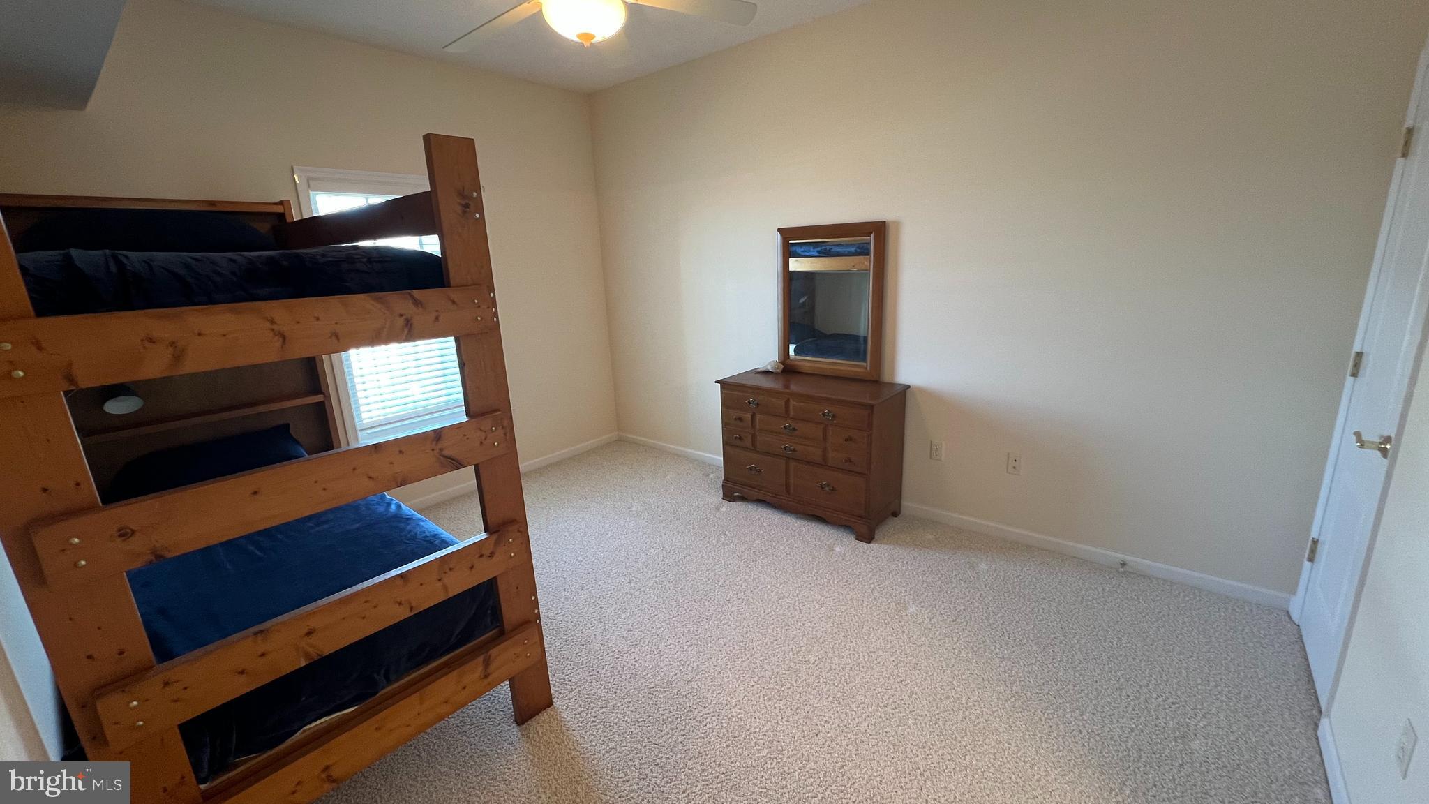 103 Williams Street, Unit 416 Crisfield, MD 21817 - Photo 25 of 38 a view of room with stairs and wooden floor