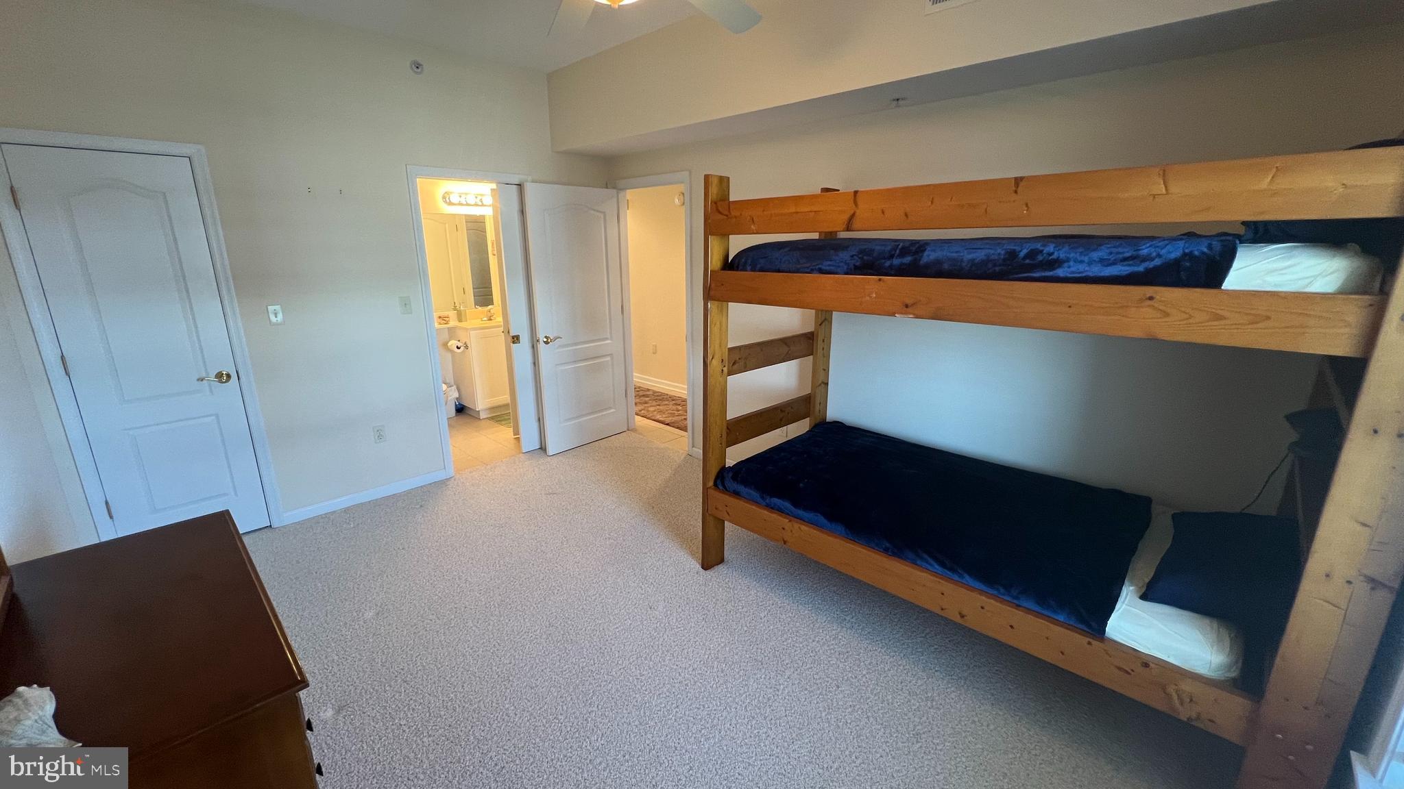 103 Williams Street, Unit 416 Crisfield, MD 21817 - Photo 27 of 38 a bedroom with furniture and window