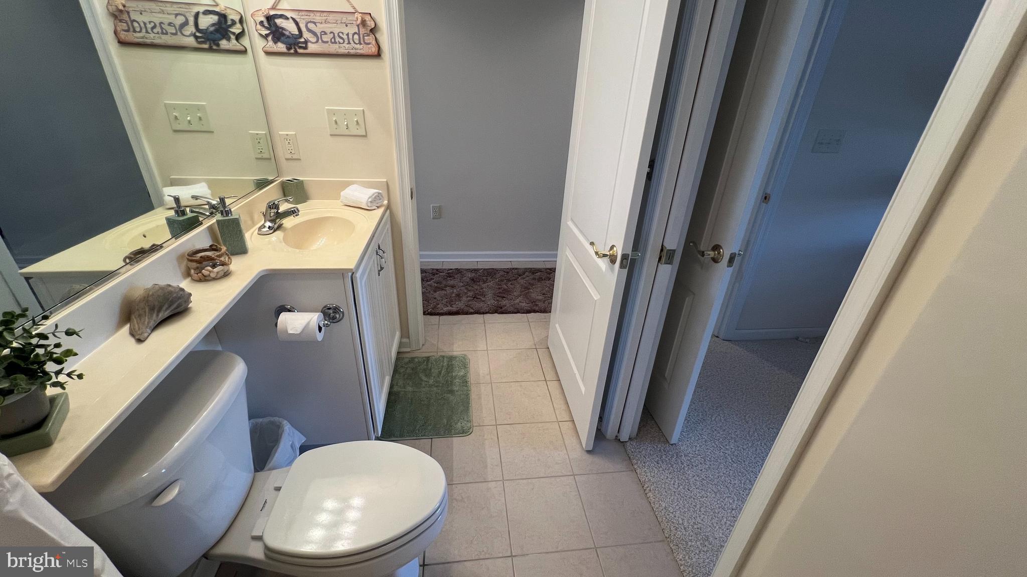 103 Williams Street, Unit 416 Crisfield, MD 21817 - Photo 28 of 38 a bathroom with a toilet and a sink