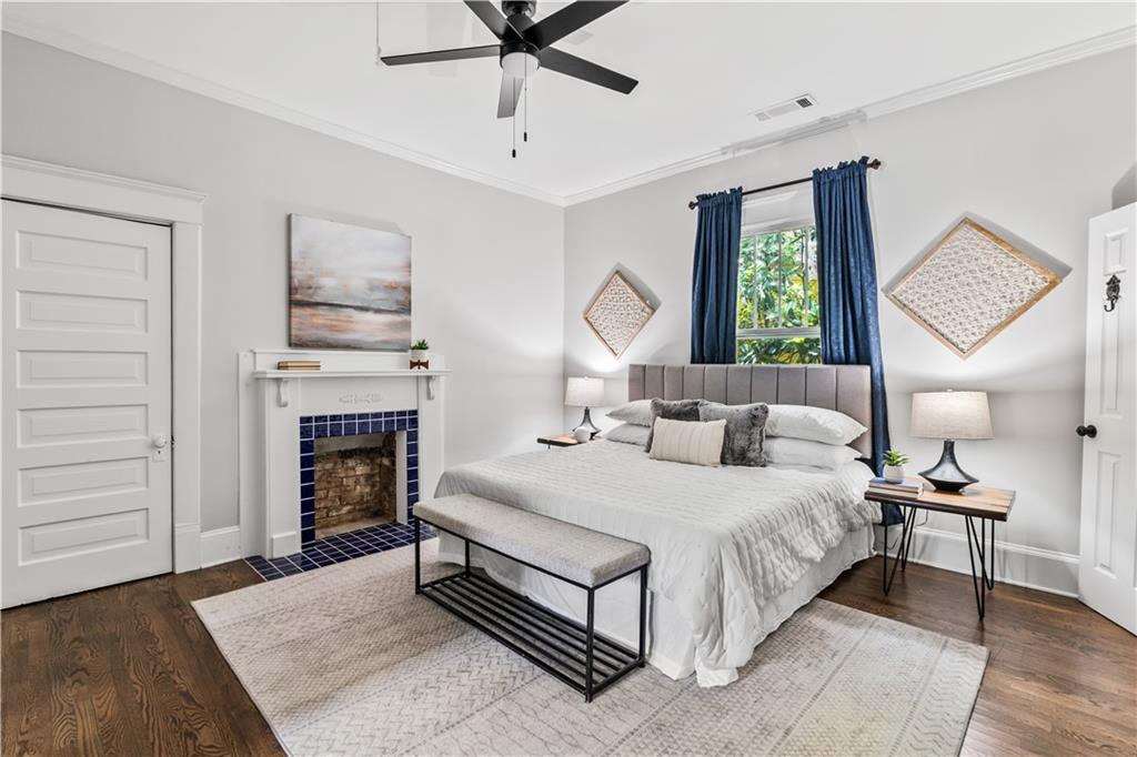 240 Melrose Avenue Decatur, GA 30030 - Photo 13 of 32 a bedroom with a bed and a fireplace