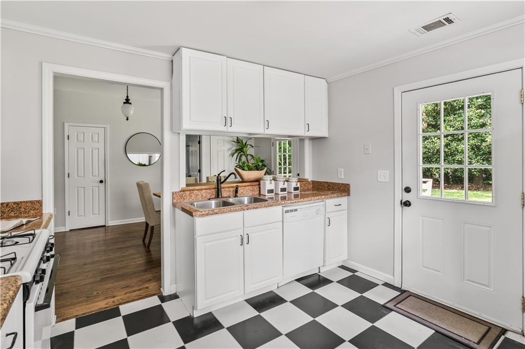 240 Melrose Avenue Decatur, GA 30030 - Photo 18 of 32 a kitchen with a stove a sink and a refrigerator