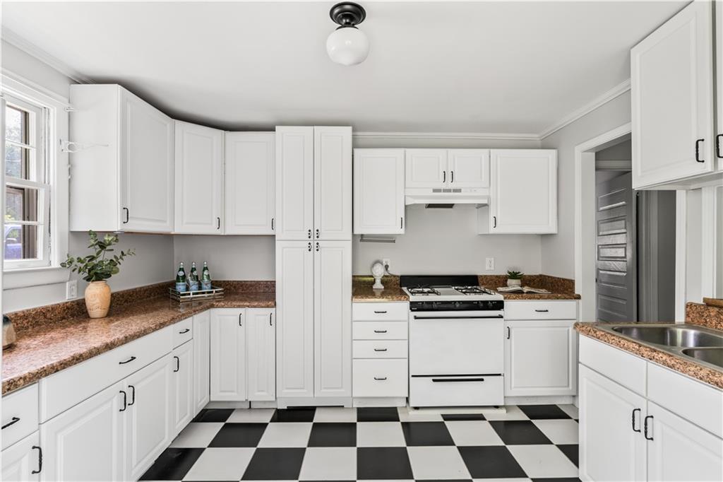240 Melrose Avenue Decatur, GA 30030 - Photo 19 of 32 a kitchen with stainless steel appliances a stove a sink and a refrigerator