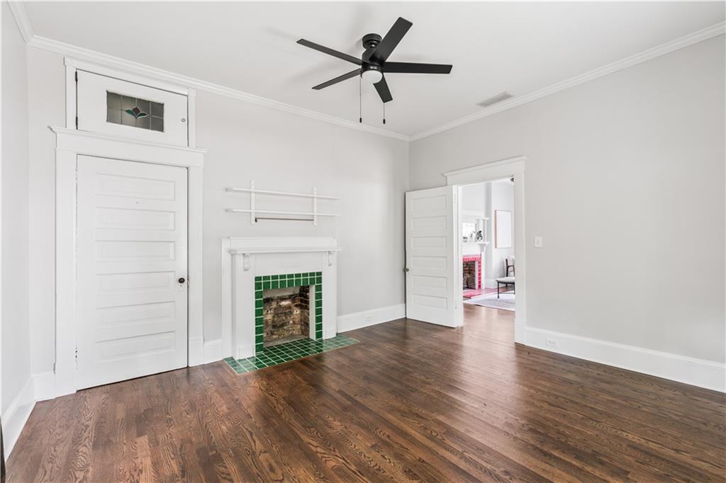 240 Melrose Avenue Decatur, GA 30030 - Photo 22 of 32 a view of an empty room with wooden floor fireplace and a window