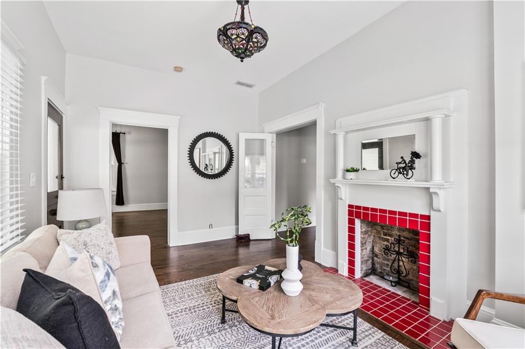 240 Melrose Avenue Decatur, GA 30030 - Photo 9 of 32 a living room with furniture a clock and a view of kitchen