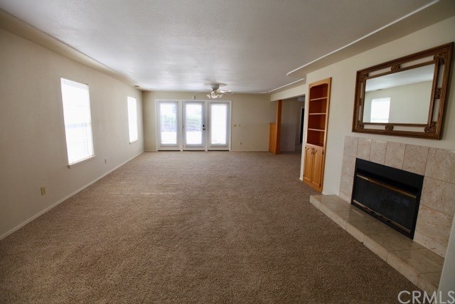 520 Lupine Lane Templeton, CA 93465 - Photo 11 of 25 Spacious living room with double-sided fireplace
