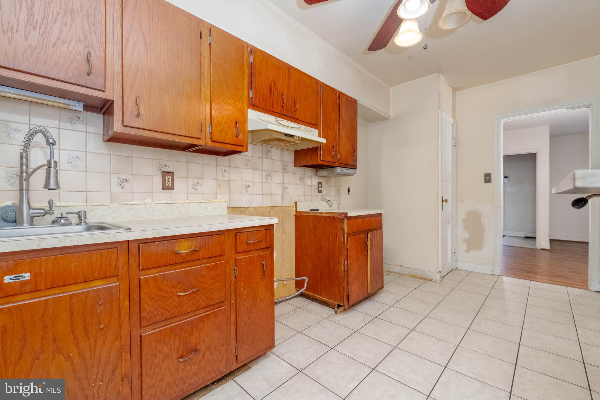 1517 North Potomac Street Baltimore, MD 21213 - Photo 11 of 44 a kitchen with stainless steel appliances granite countertop a sink and cabinets