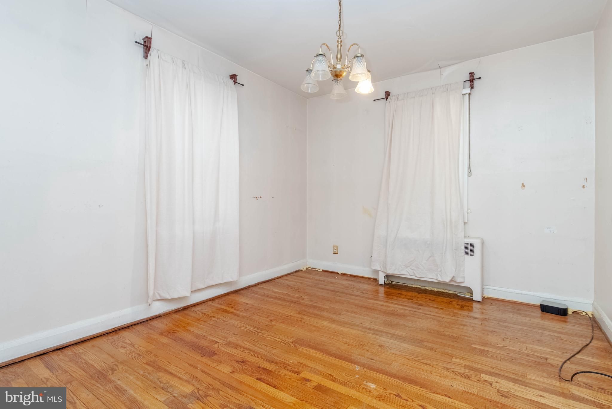 1517 North Potomac Street Baltimore, MD 21213 - Photo 13 of 44 a view of a room with wooden floor
