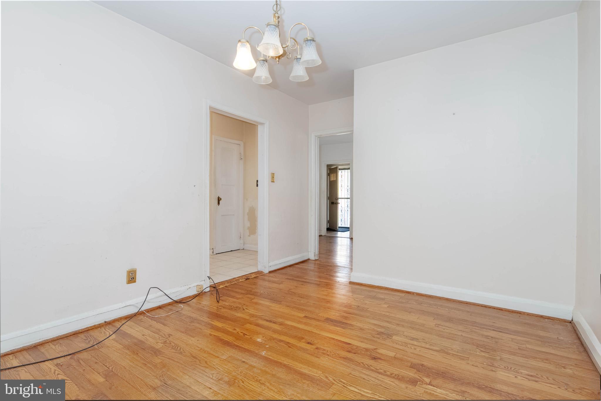 1517 North Potomac Street Baltimore, MD 21213 - Photo 14 of 44 a view of an empty room with wooden floor