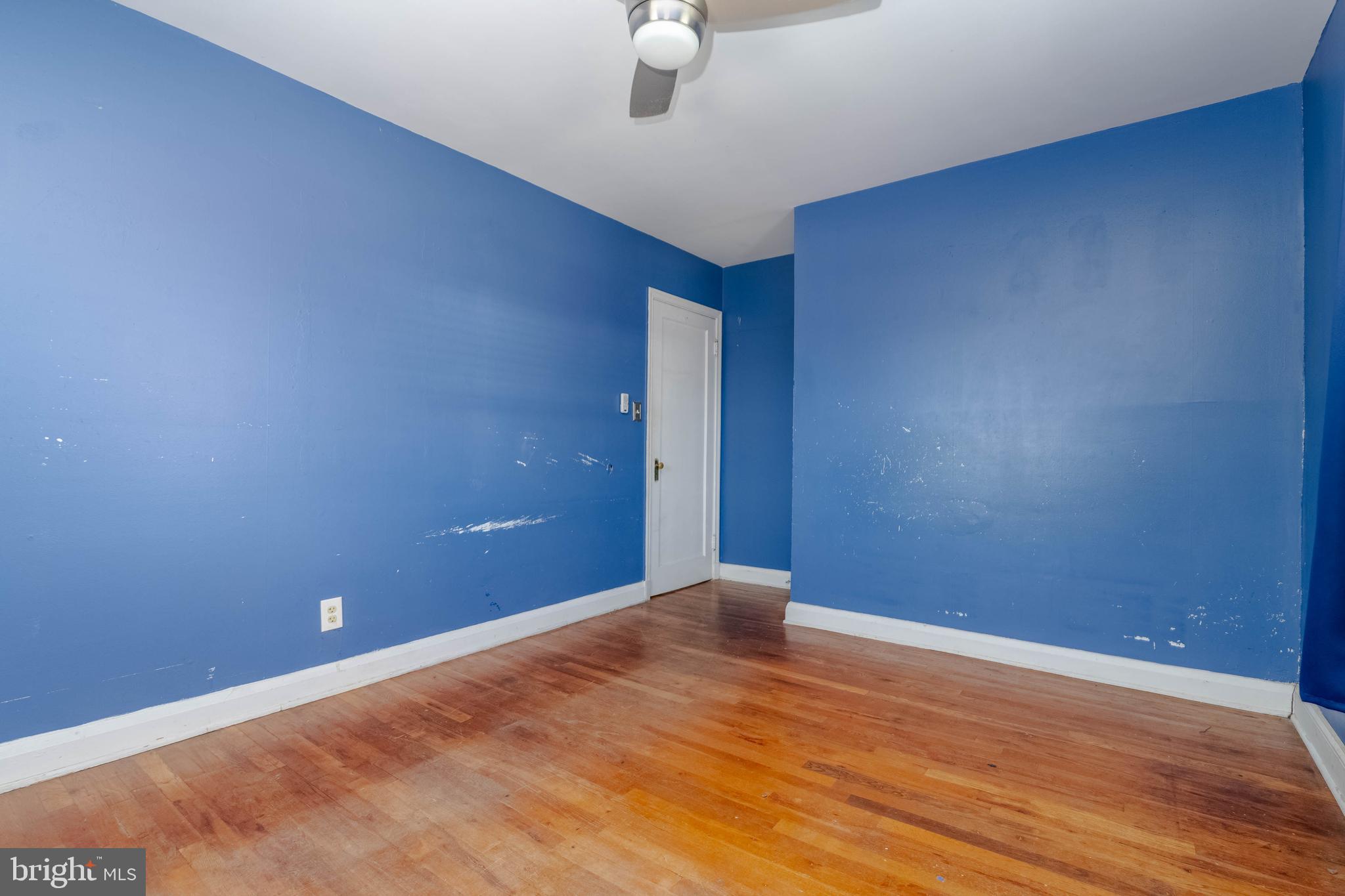 1517 North Potomac Street Baltimore, MD 21213 - Photo 22 of 44 a view of an empty room with wooden floor