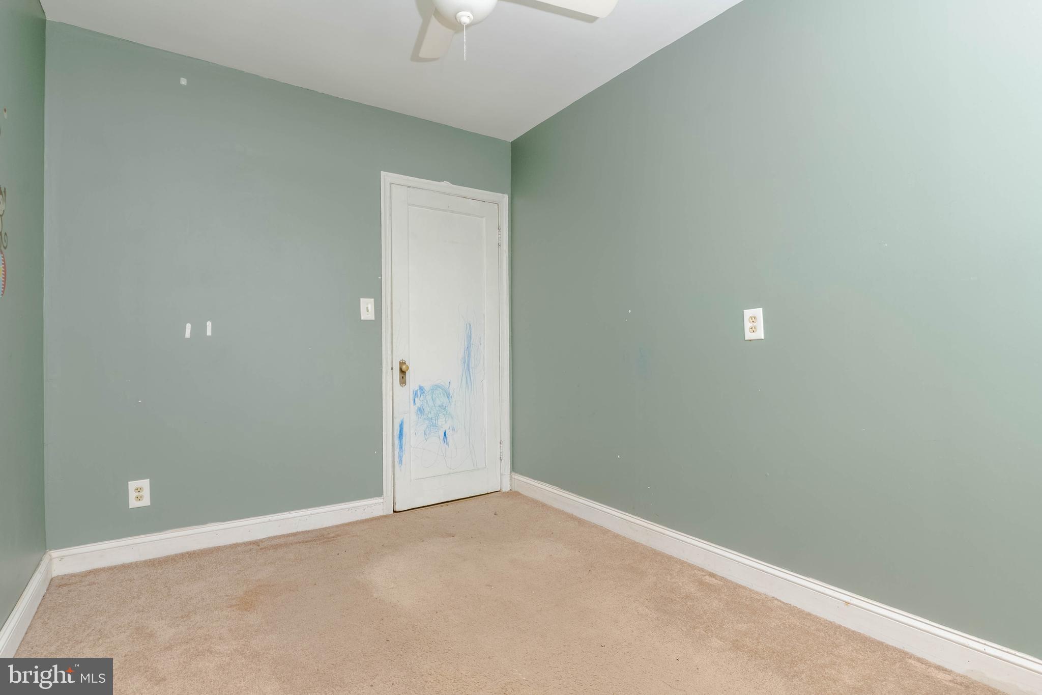 1517 North Potomac Street Baltimore, MD 21213 - Photo 26 of 44 an empty room with a chandelier fan