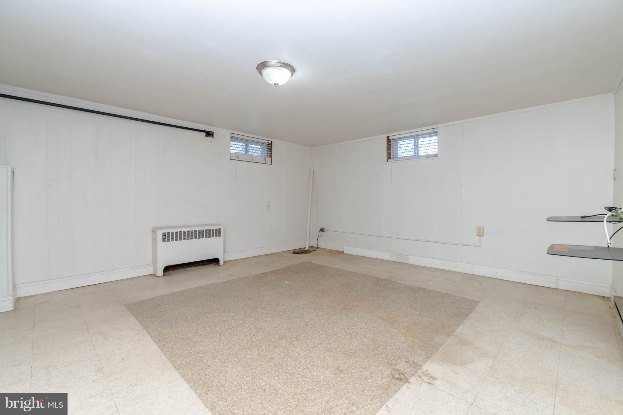 1517 North Potomac Street Baltimore, MD 21213 - Photo 29 of 44 an empty room with a workbench
