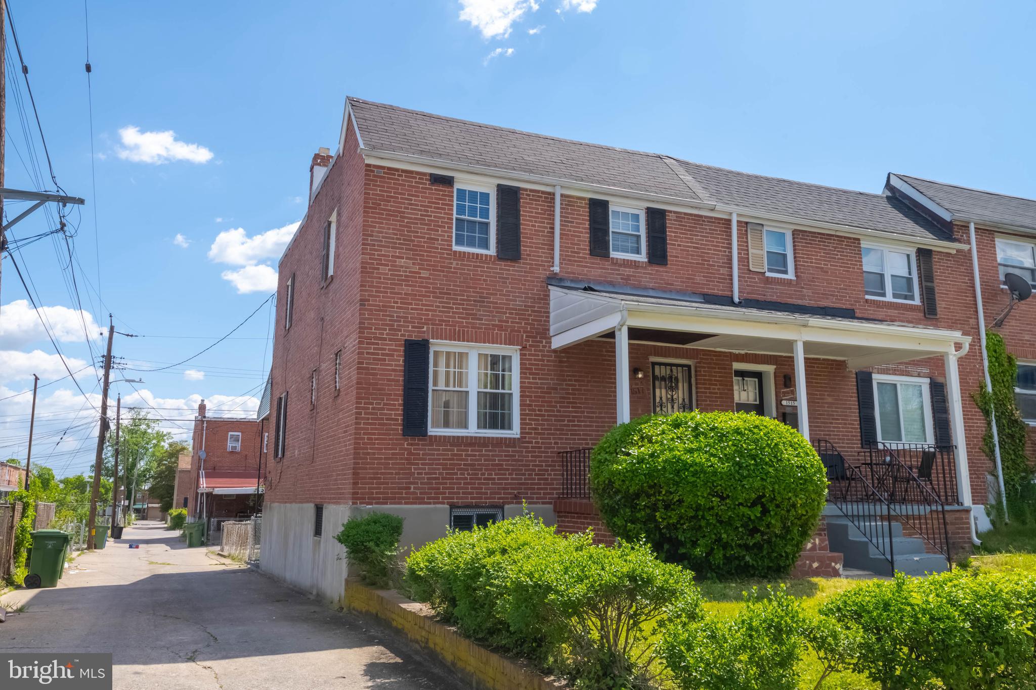 1517 North Potomac Street Baltimore, MD 21213 - Photo 3 of 44 a view of a brick house with a yard and plants