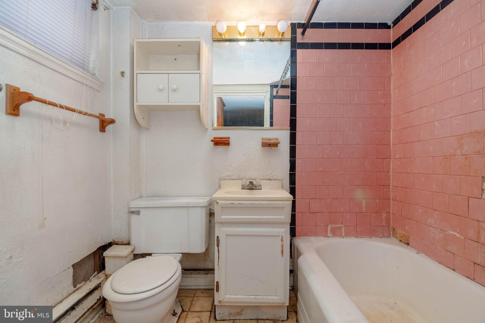 1517 North Potomac Street Baltimore, MD 21213 - Photo 36 of 44 a bathroom with a sink a toilet and shower