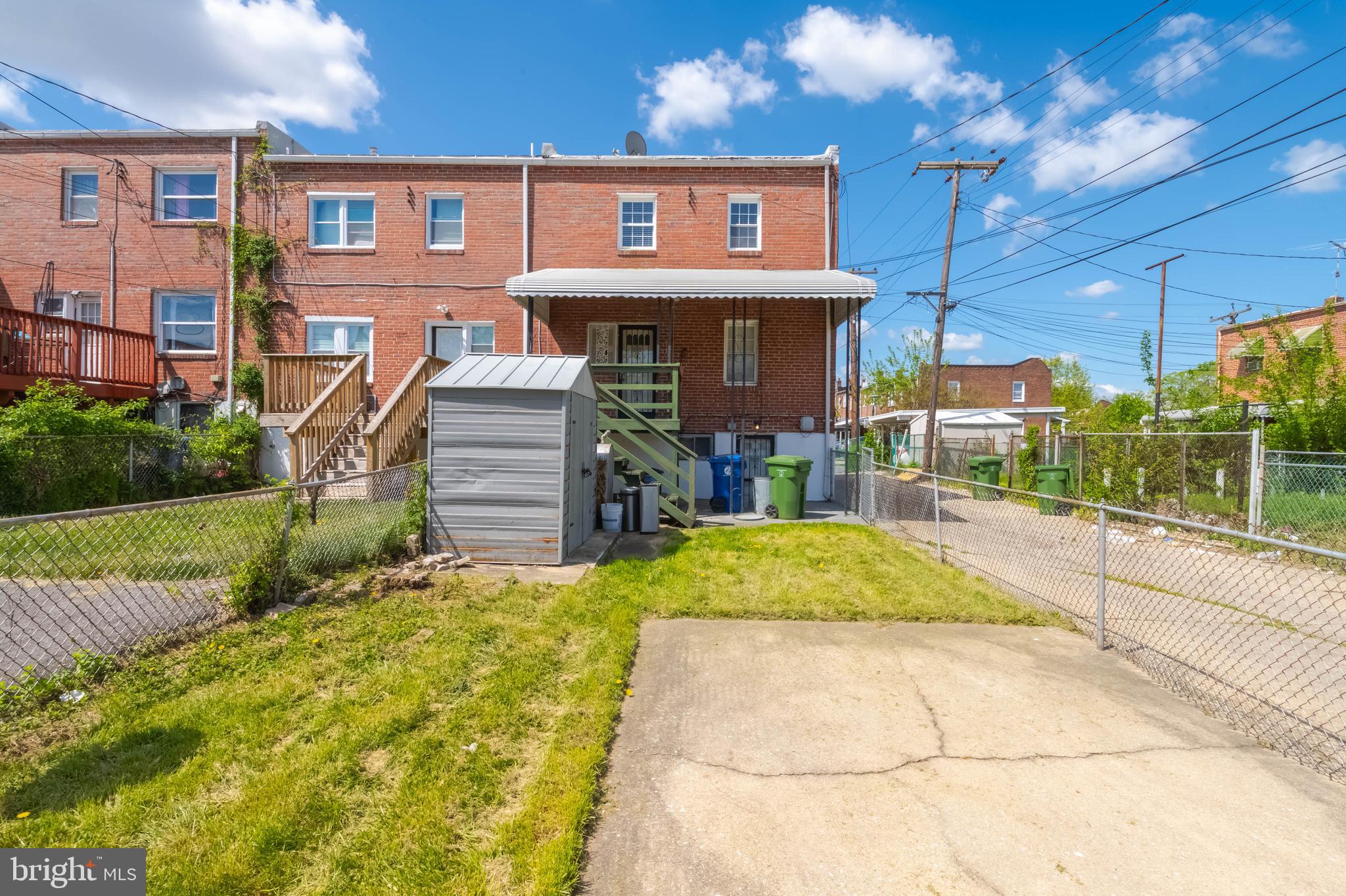 1517 North Potomac Street Baltimore, MD 21213 - Photo 40 of 44 a front view of a house with a yard