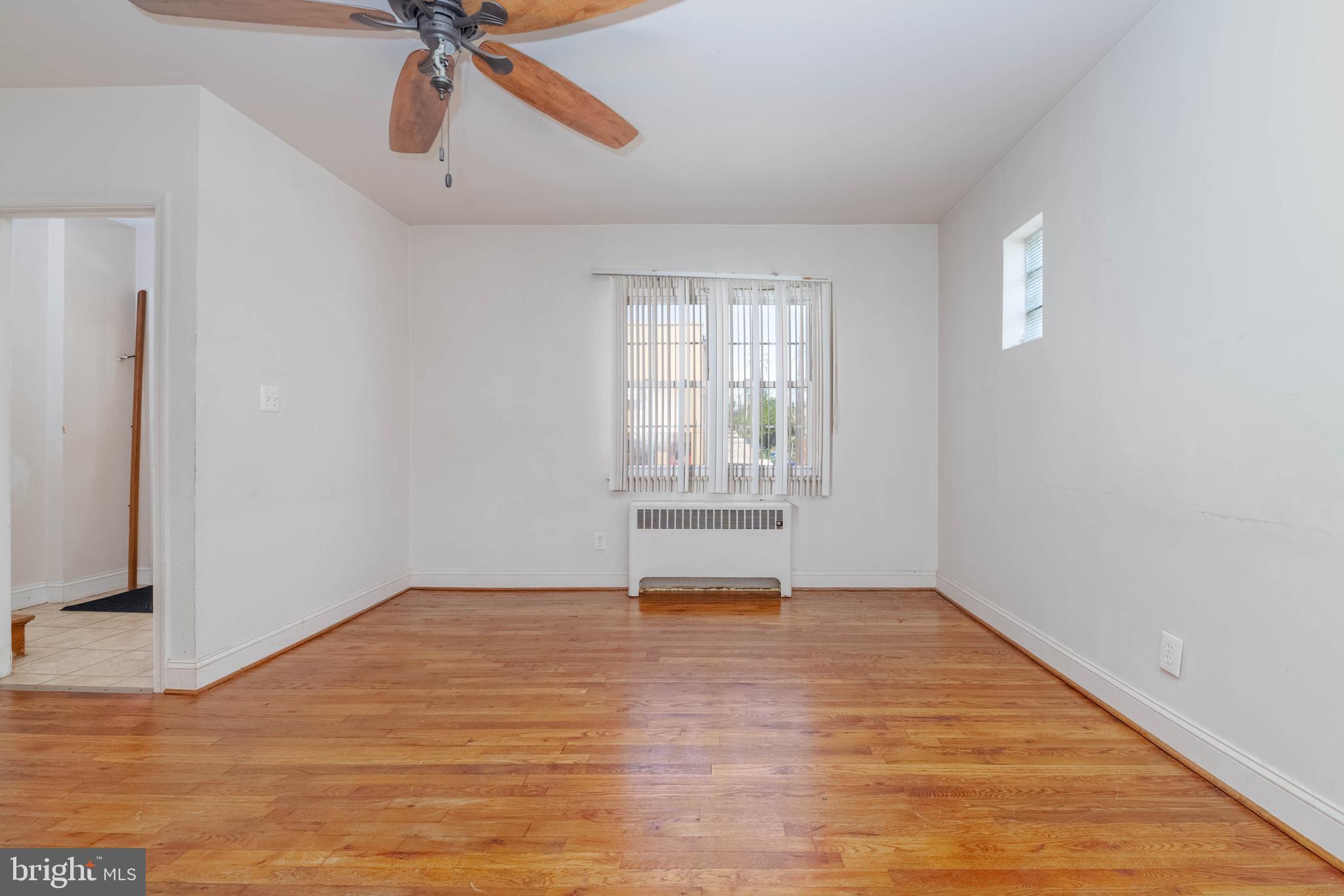 1517 North Potomac Street Baltimore, MD 21213 - Photo 4 of 44 a view of an empty room with a window