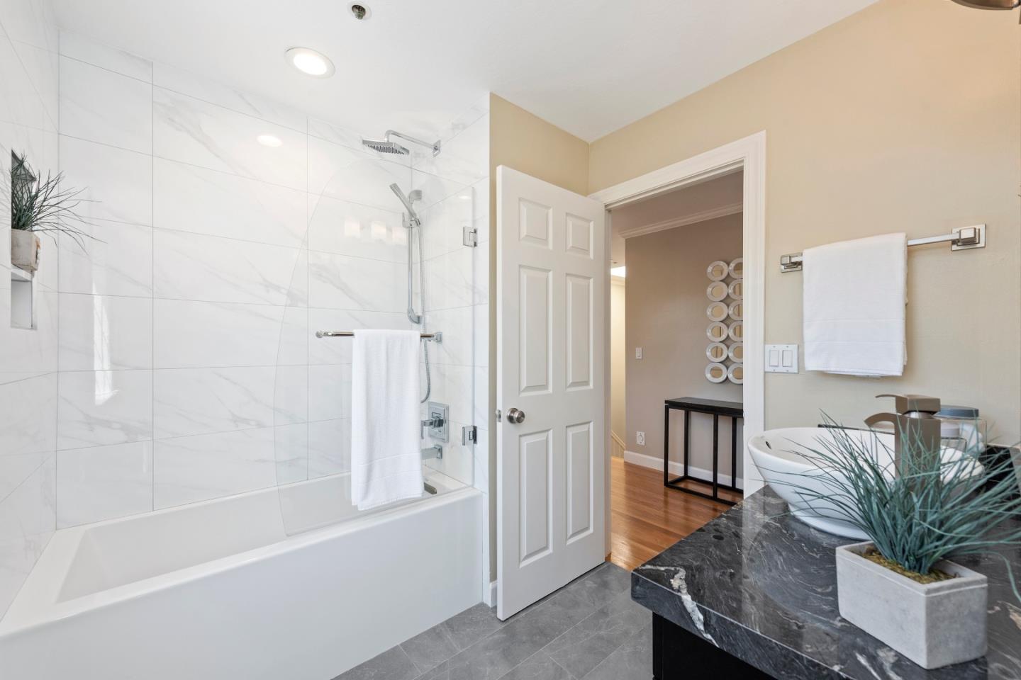 131 Giffin Road Los Altos, CA 94022 - Photo 17 of 29 a bathroom with a tub shower sink and a sink