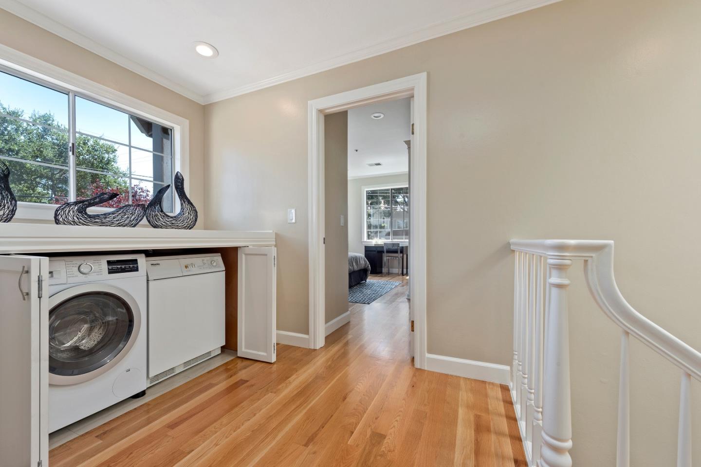 131 Giffin Road Los Altos, CA 94022 - Photo 18 of 29 a view of a hallway with washer and dryer