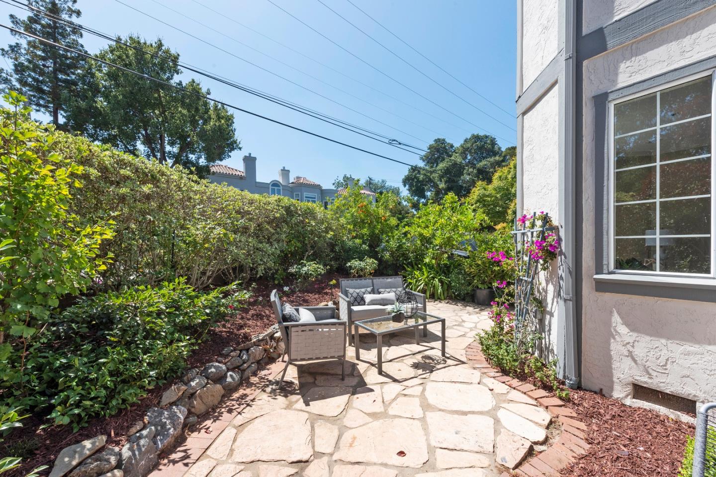 131 Giffin Road Los Altos, CA 94022 - Photo 4 of 29 a view of a patio with table and chairs and potted plants
