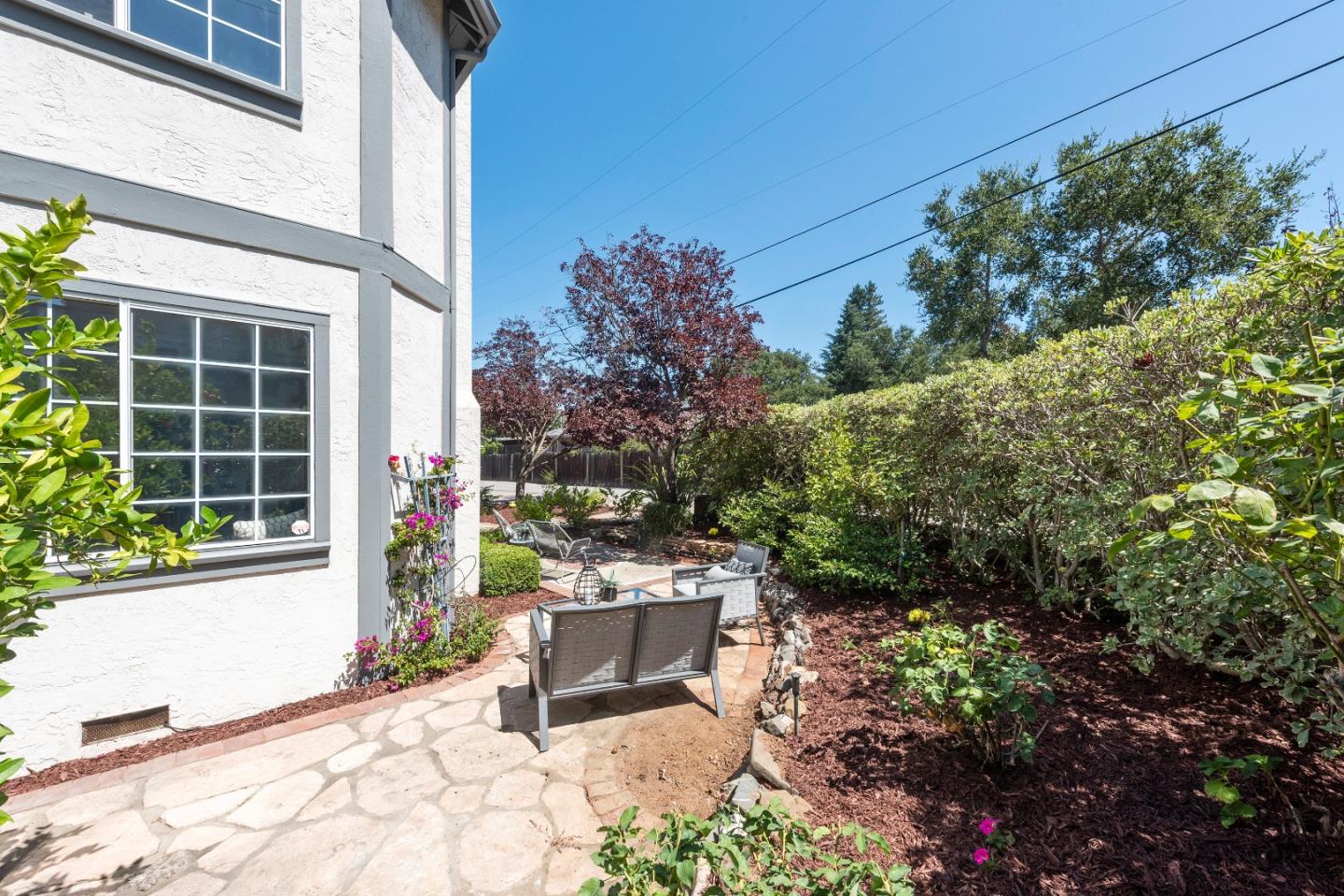 131 Giffin Road Los Altos, CA 94022 - Photo 5 of 29 a view of a chair and table in the backyard