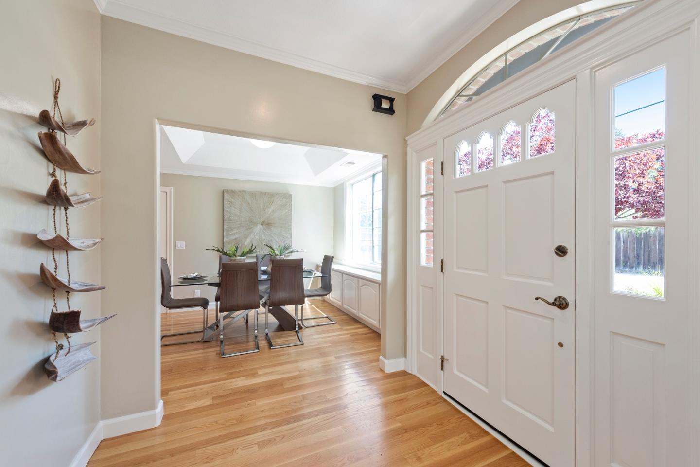 131 Giffin Road Los Altos, CA 94022 - Photo 7 of 29 a dining room with furniture a chandelier and wooden floor