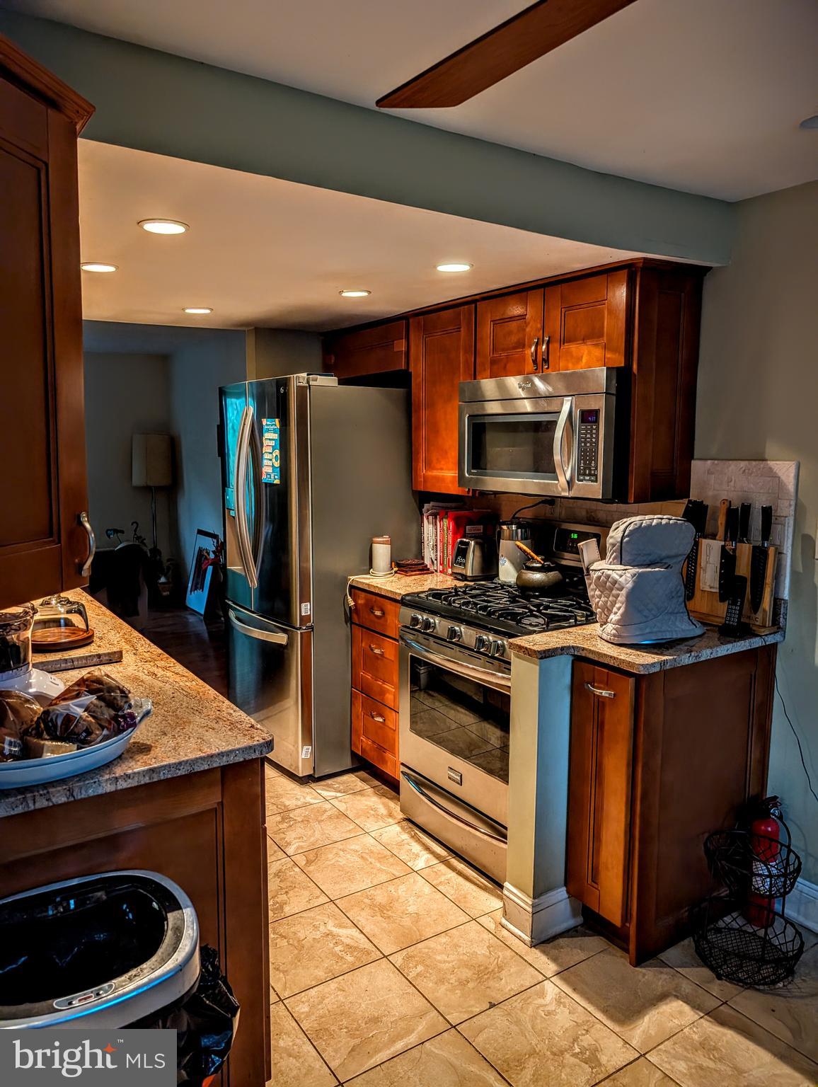 5451 Fallriver Row Court Columbia, MD 21044 - Photo 3 of 11 a kitchen with stainless steel appliances a stove a sink and a refrigerator