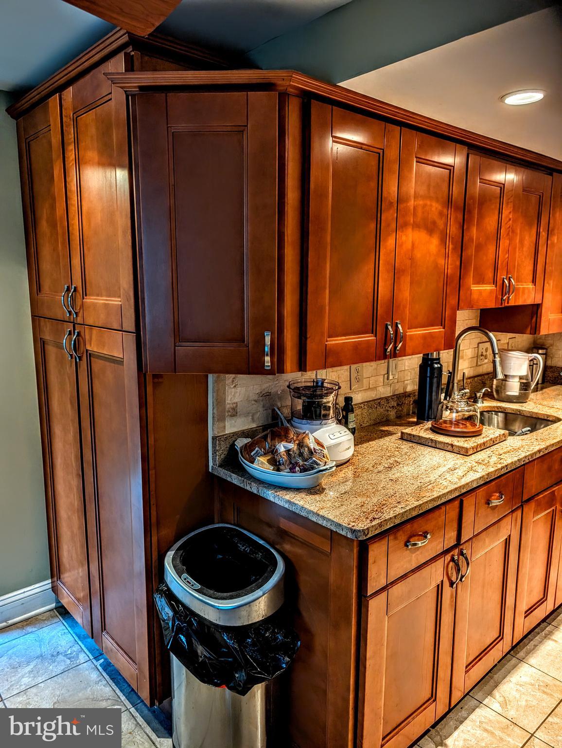5451 Fallriver Row Court Columbia, MD 21044 - Photo 4 of 11 a bathroom with a sink a toilet and a mirror