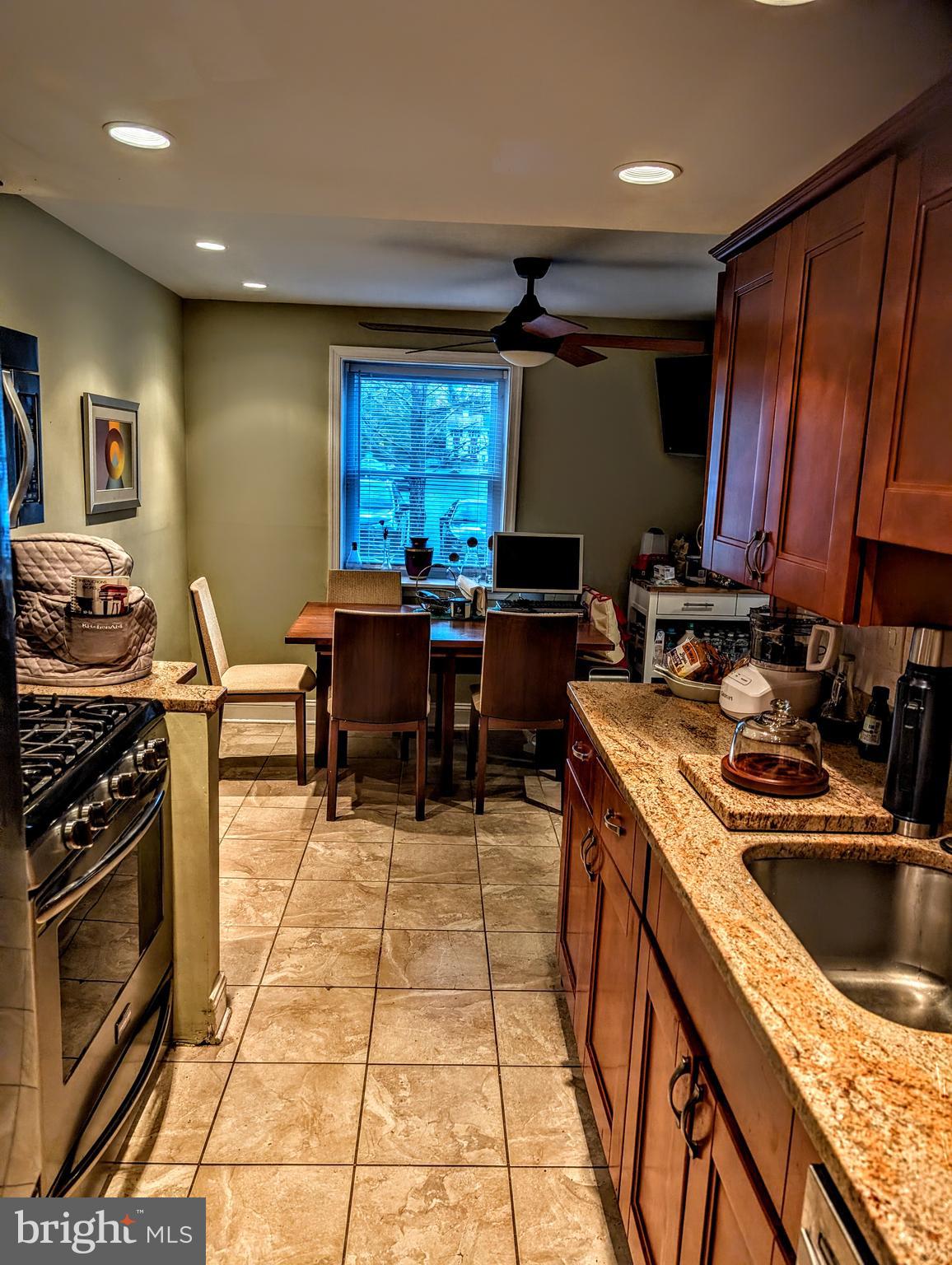 5451 Fallriver Row Court Columbia, MD 21044 - Photo 5 of 11 a kitchen with stainless steel appliances granite countertop sink stove top oven and cabinets