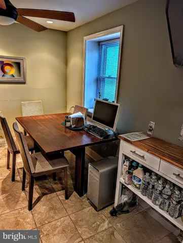 a view of a workspace with furniture