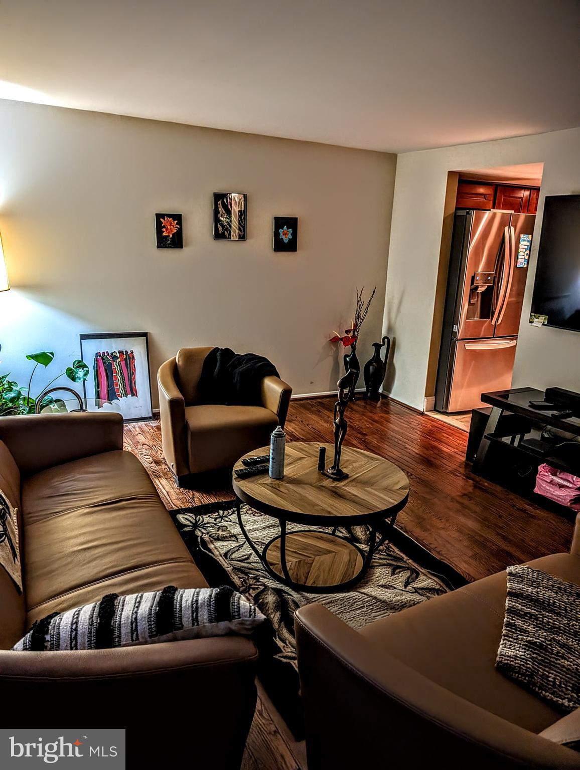5451 Fallriver Row Court Columbia, MD 21044 - Photo 9 of 11 a living room with furniture and wooden floor