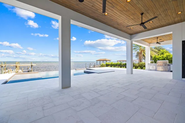 a view of a swimming pool with an ocean view