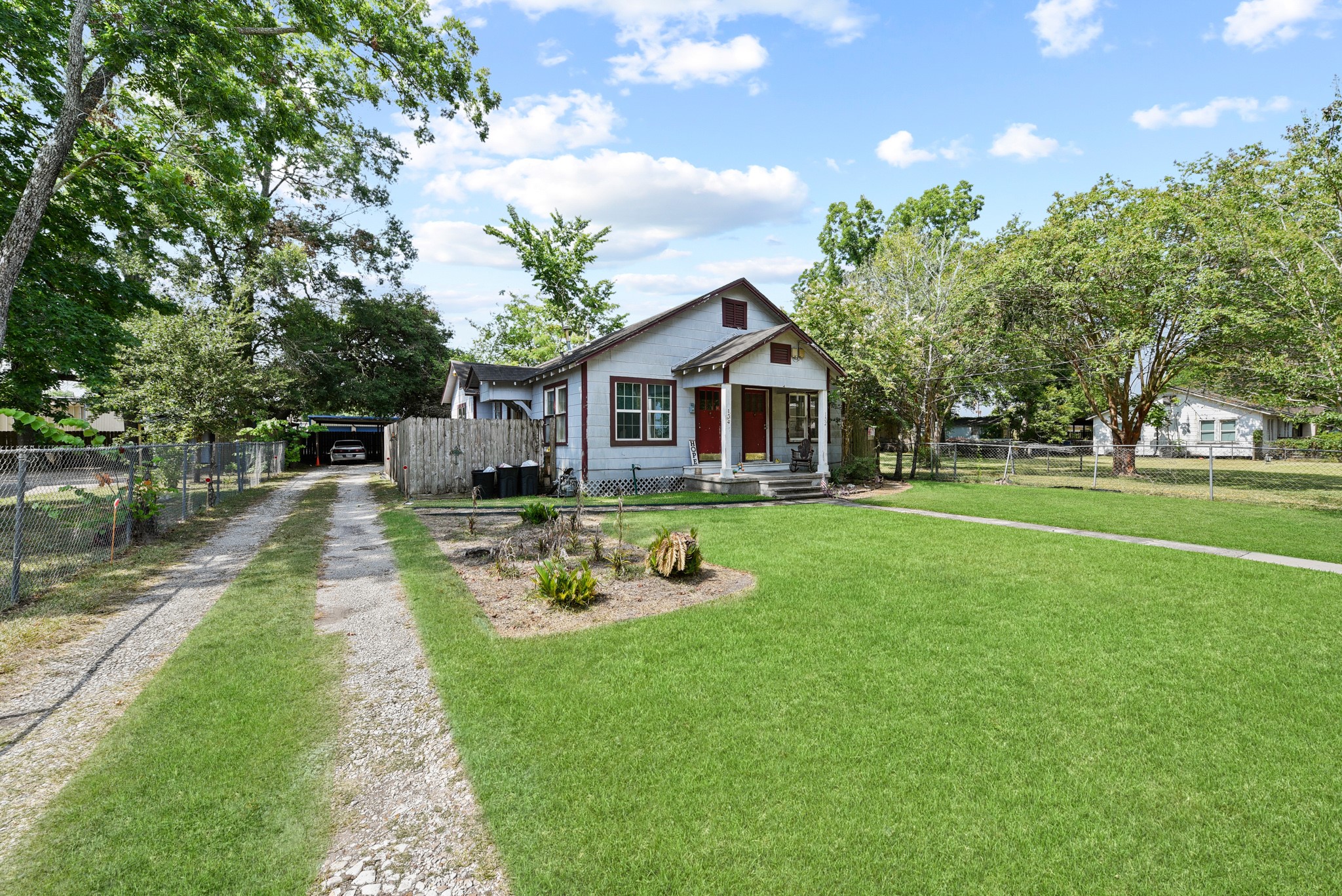 154 Willow Street Humble, TX 77338 - Photo 3 of 8 a front view of a house with garden