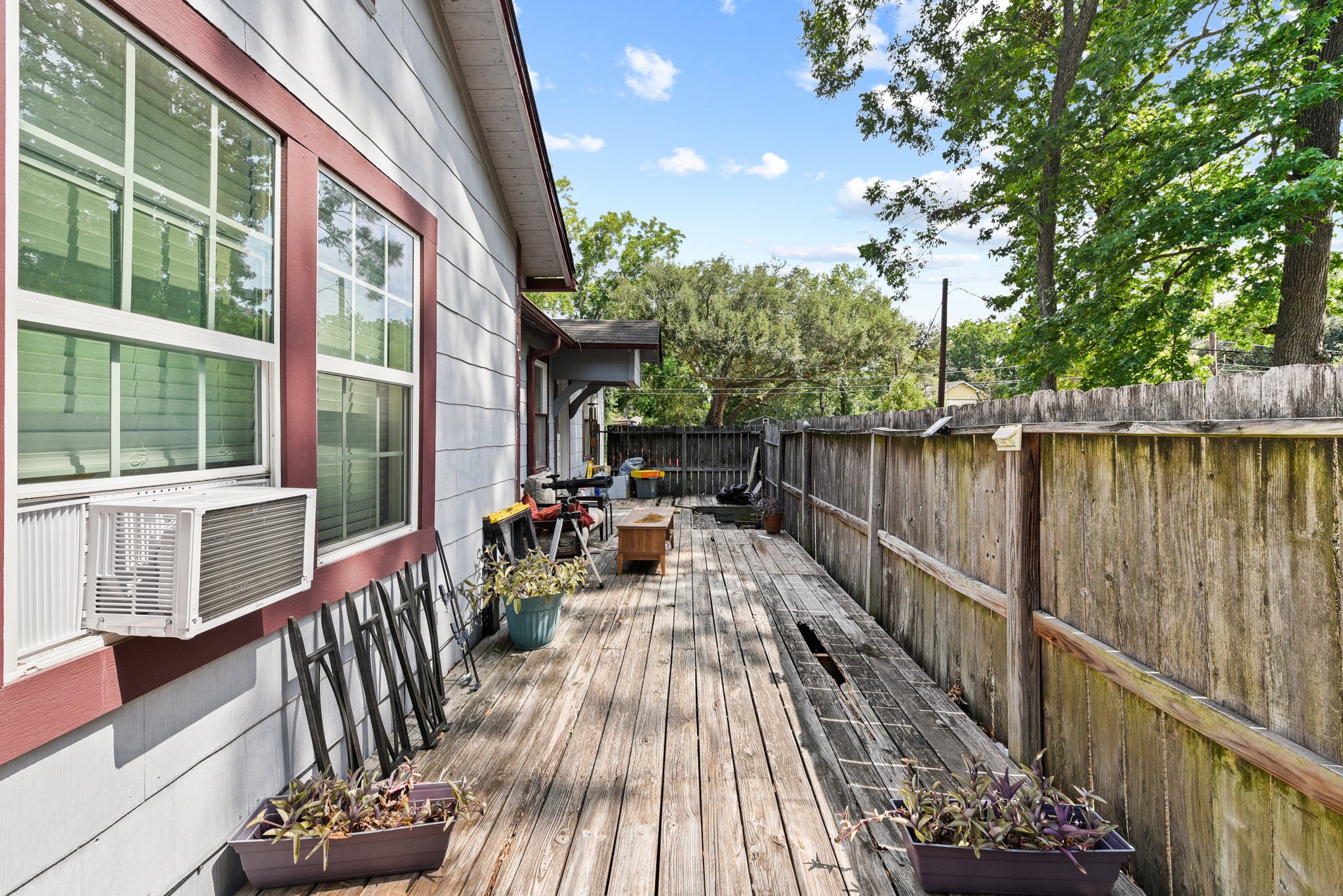 154 Willow Street Humble, TX 77338 - Photo 6 of 8 a view of balcony with chairs and wooden fence