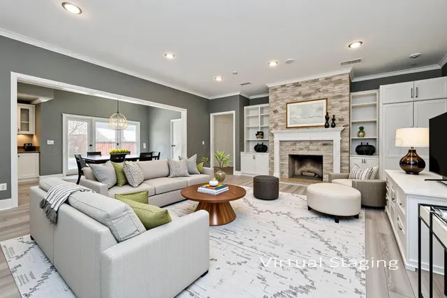 a large white kitchen with cabinets