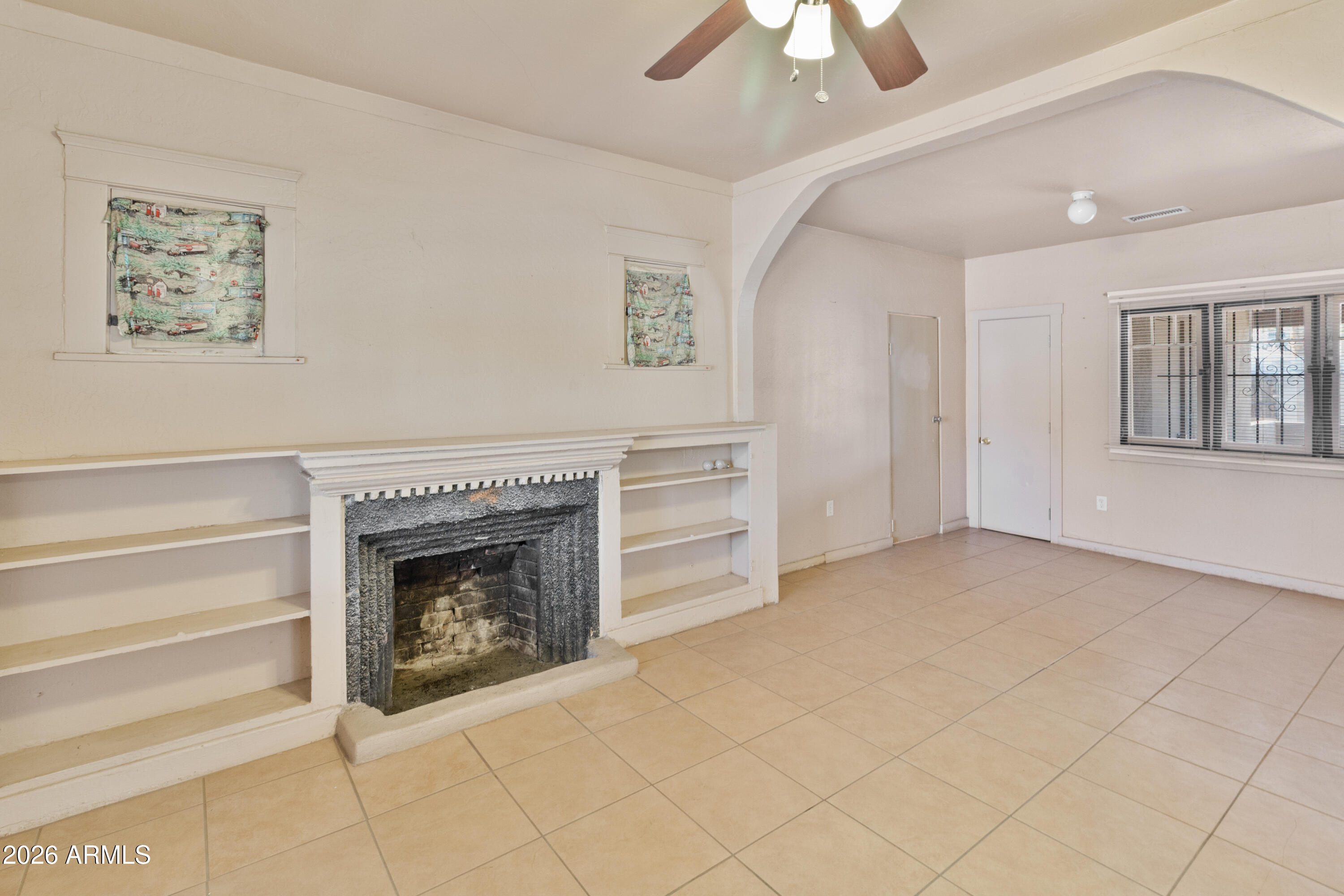 1237 East Pierce Street Phoenix, AZ 85006 - Photo 5 of 23 wooden floor fireplace and windows in an empty room