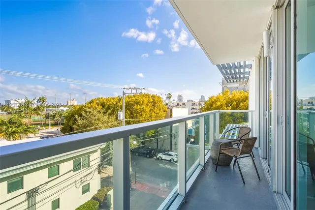a view of balcony with furniture