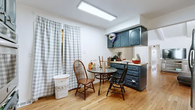 a view of a livingroom with furniture and a flat screen tv