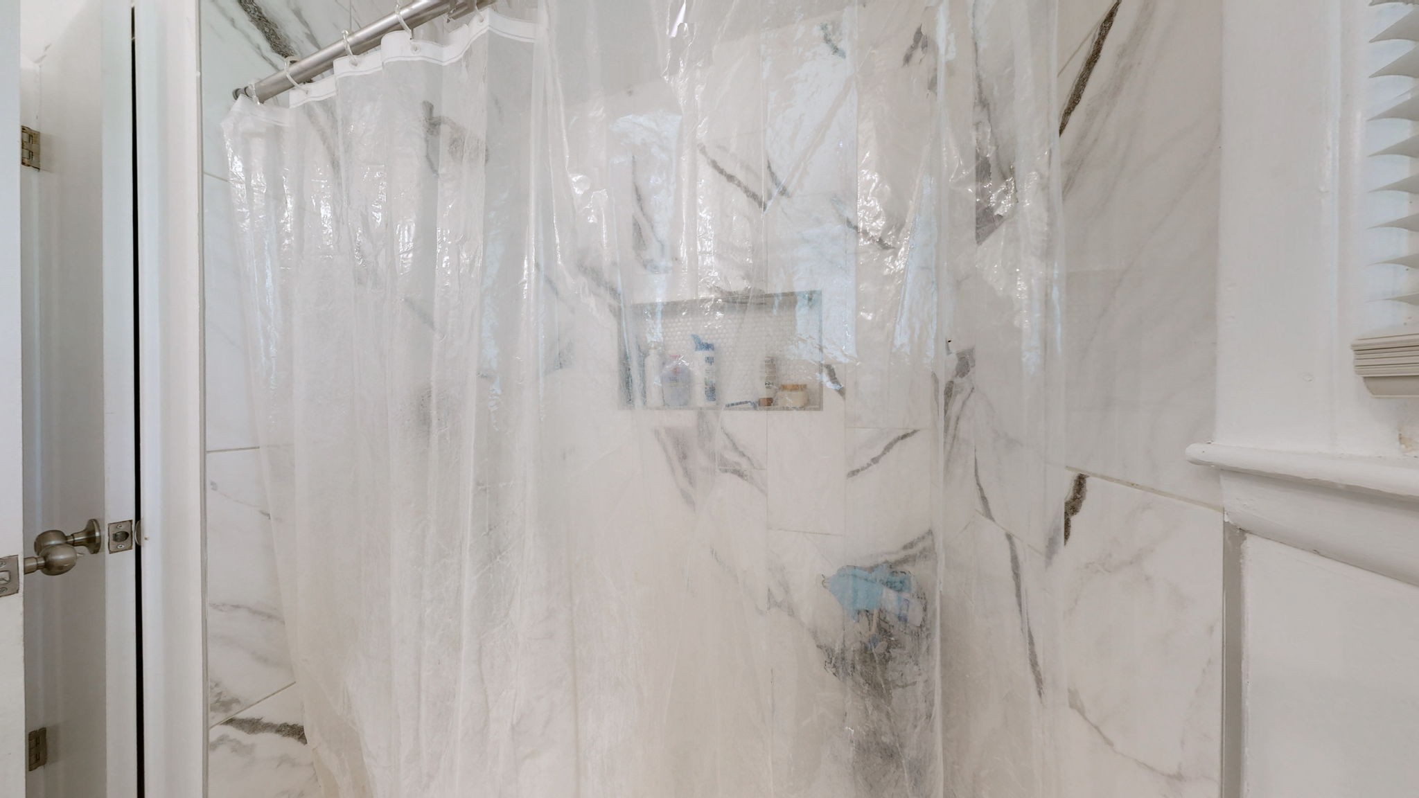 7181 Bidwell Road Joelton, TN 37080 - Photo 25 of 33 a bathroom with a shower curtain