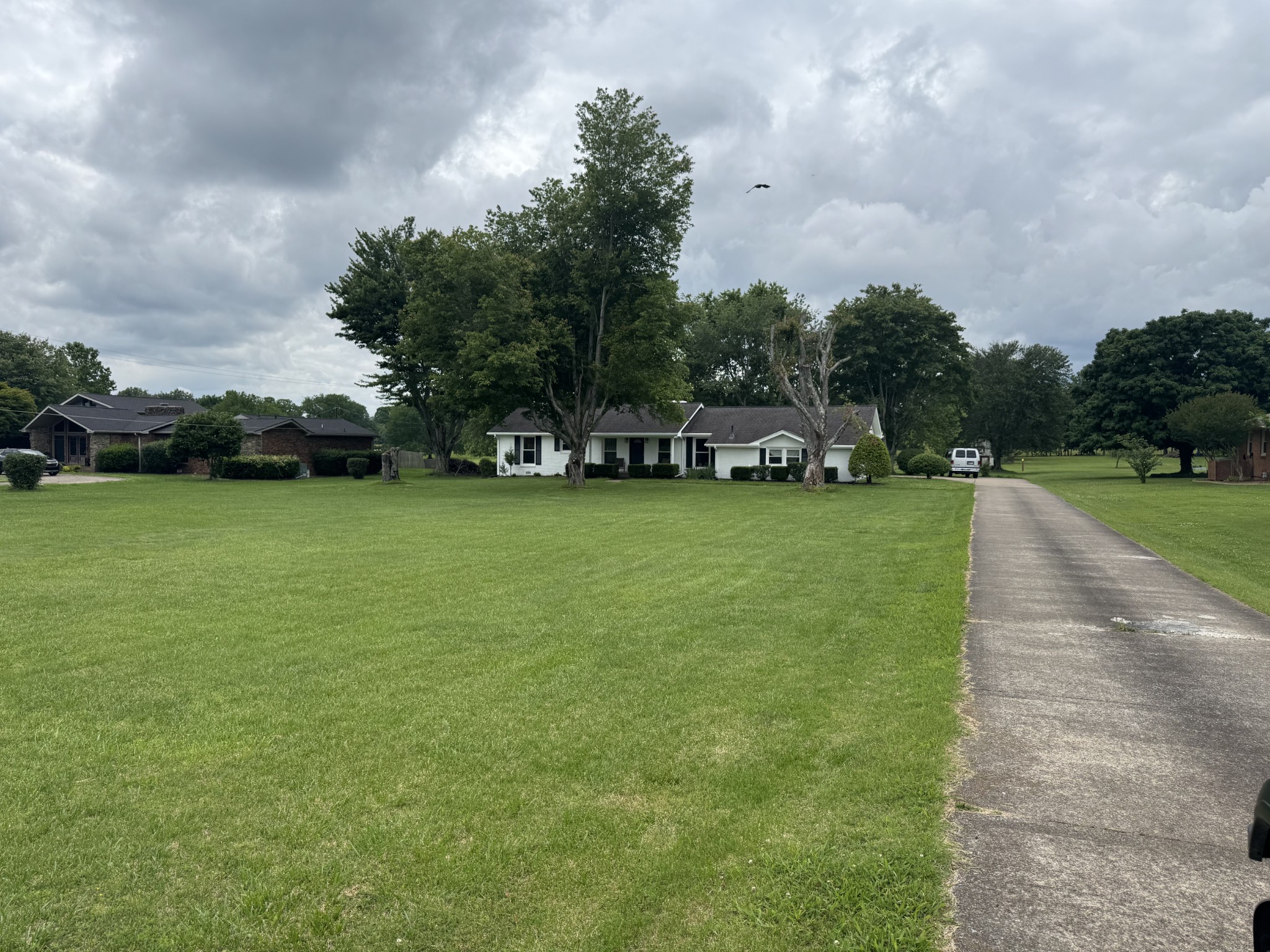 7181 Bidwell Road Joelton, TN 37080 - Photo 10 of 33 a view of a field with houses in the background