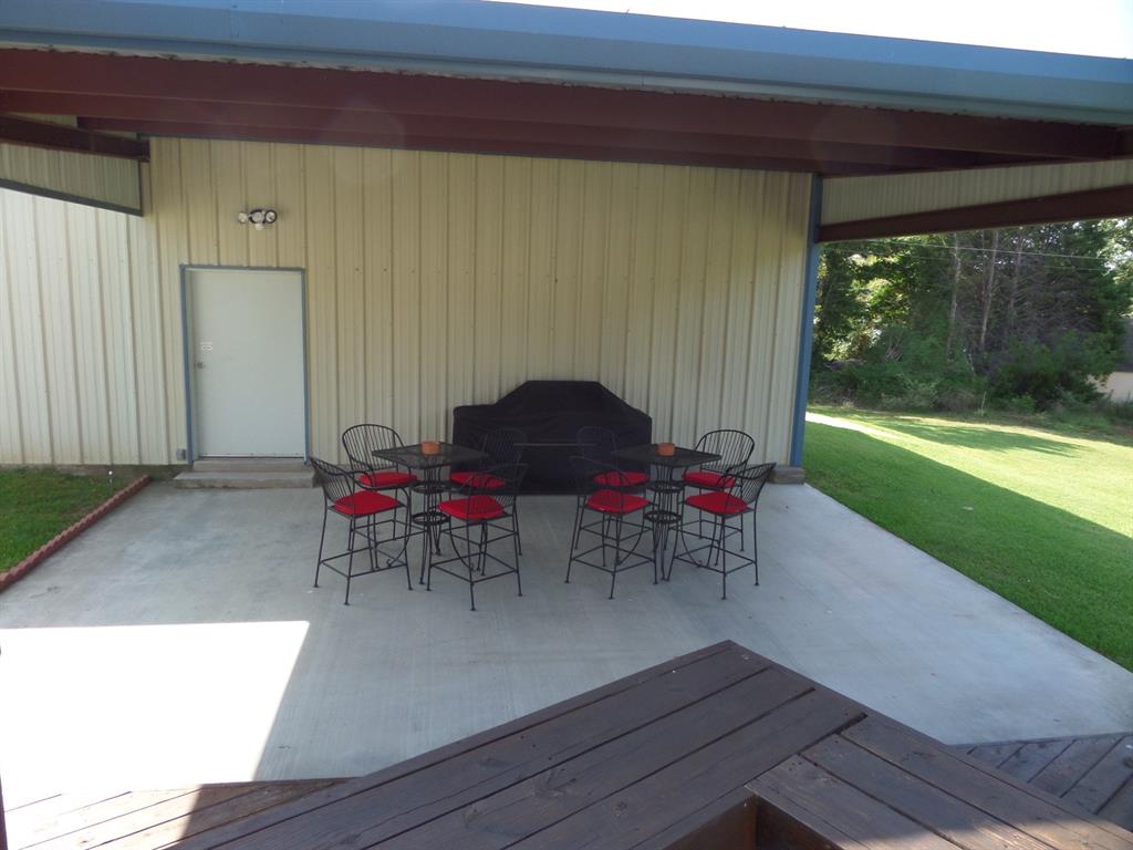 233 Esquire Estates Road Mabank, TX 75156 - Photo 28 of 34 a view of a chairs and table in the patio
