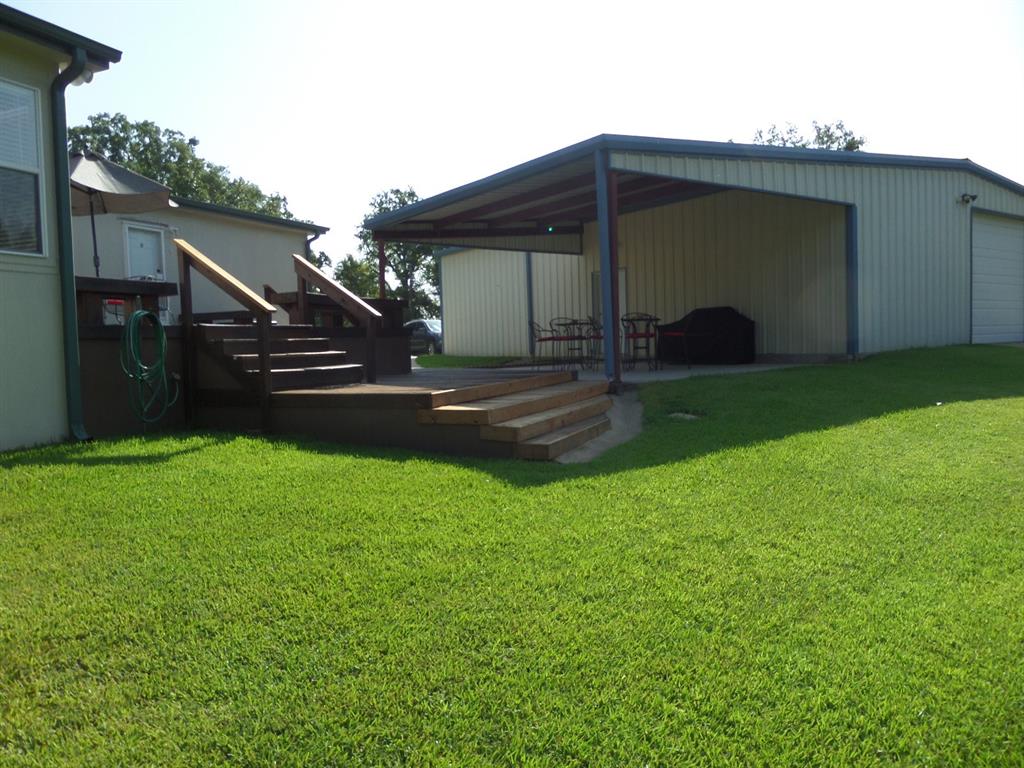 233 Esquire Estates Road Mabank, TX 75156 - Photo 29 of 34 a view of a house with a backyard