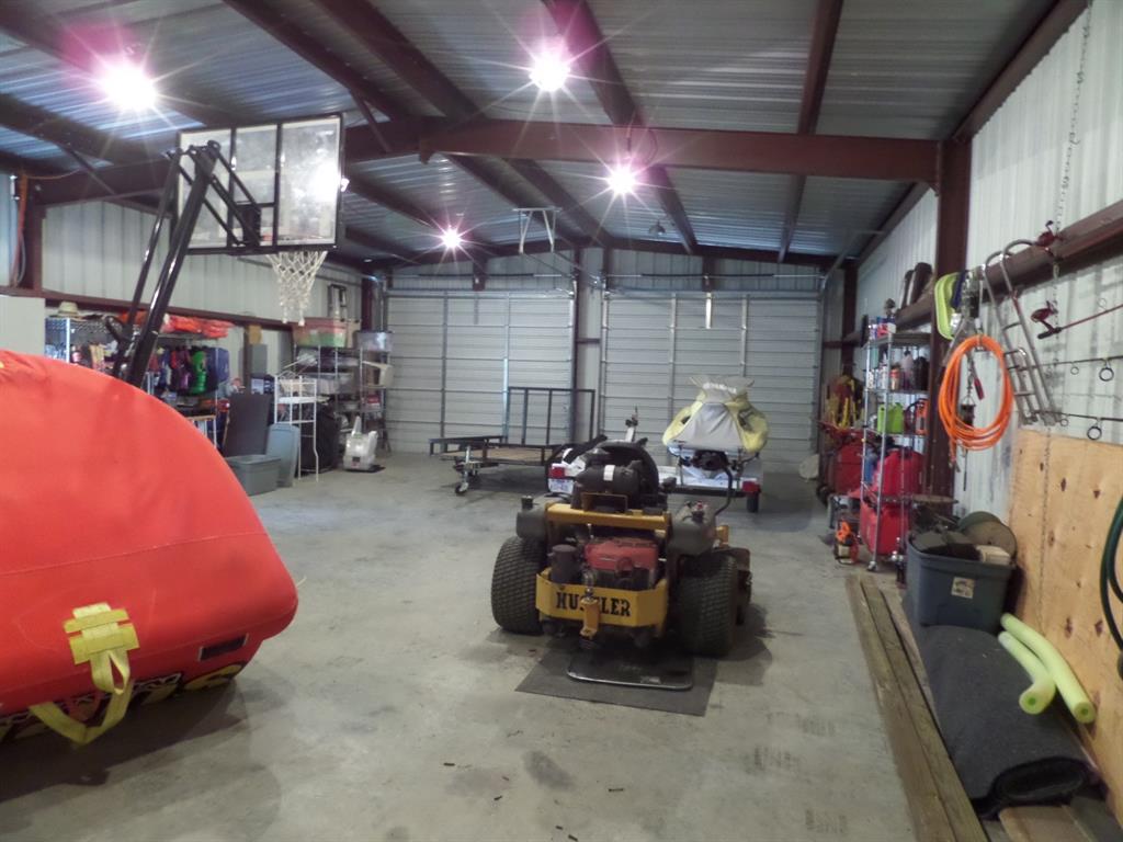 233 Esquire Estates Road Mabank, TX 75156 - Photo 31 of 34 a garage with furniture and a garage