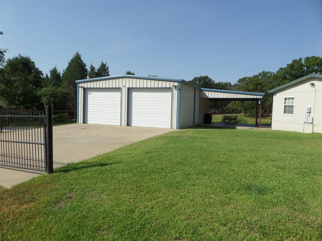 233 Esquire Estates Road Mabank, TX 75156 - Photo 34 of 34 a front view of a house with a yard and garage